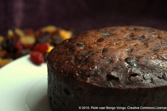 fruit_cake_with_raisins_in_background