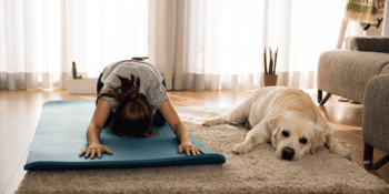 Dog next to owner working out
