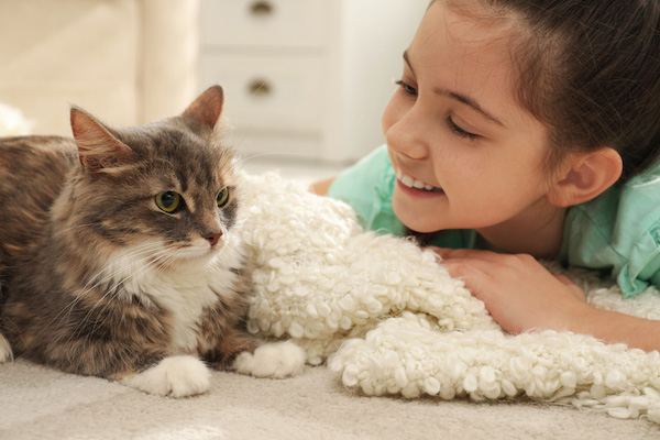 cat with young girl