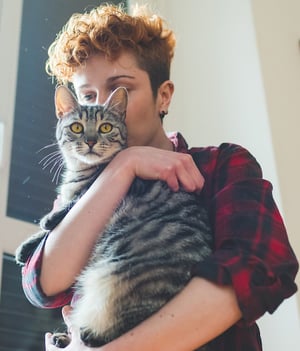 woman holding cat