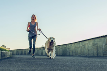 Woman running with her dog