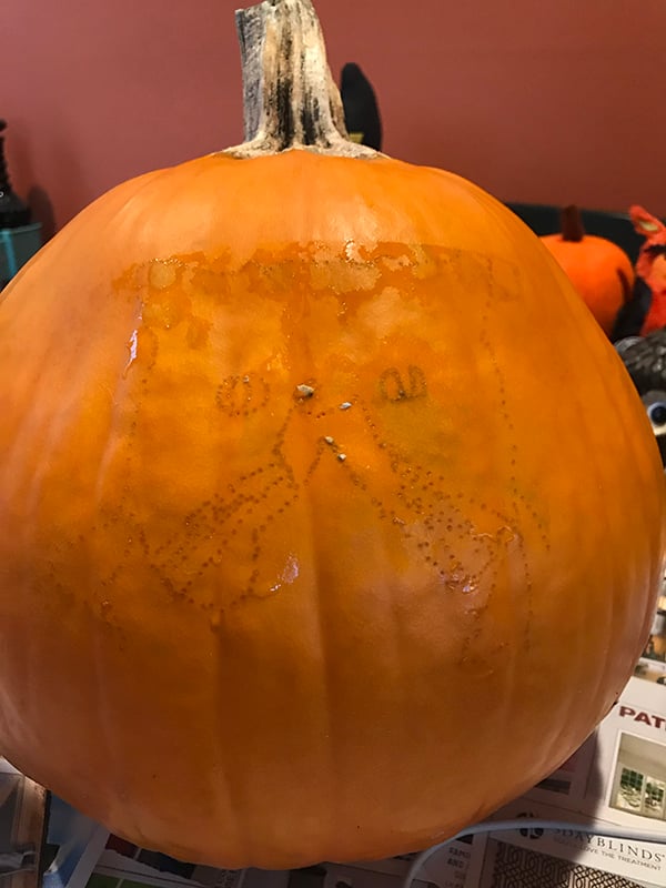 poke stencil to trace onto pumpkin