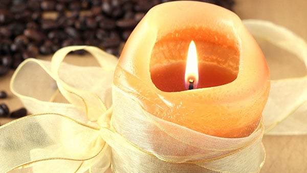 scented candle wrapped in ribbon