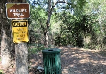 sign at trailhead stating wildlife trail and to use caution