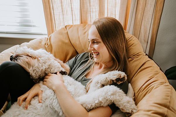 woman with dog at home